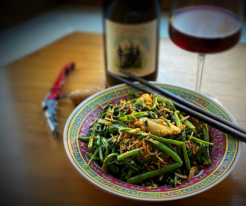 Bean dish with glass of wine at Queen's English in Washington, DC