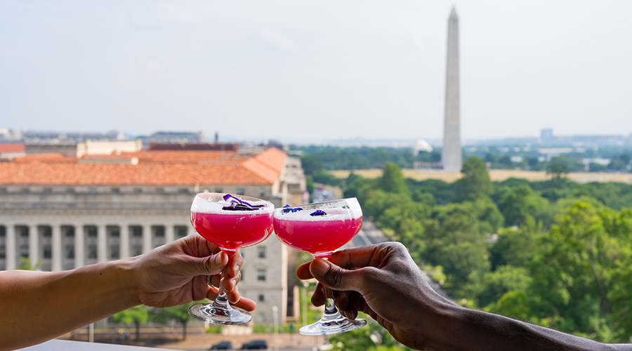 Drinks clinking on VUE Rooftop 