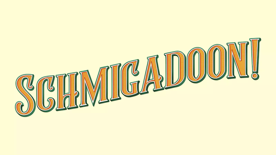 The image features the title "Schmigadoon!" in bold, playful lettering with green and orange accents, set against a light beige background, evoking a whimsical and musical tone.