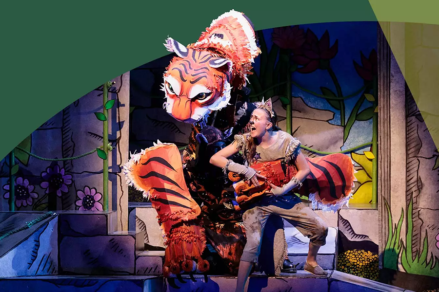 Woman and Tiger on stage performing Jungle Book