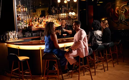 Couple dining at bar 